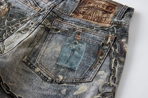 Distressed Chain-Detailed Baggy Denim Jeans