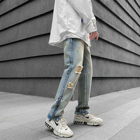 Tattered Denim Jeans with Ankle Zip